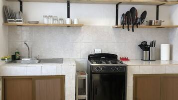 Fridge, microwave, stovetop, coffee/tea maker