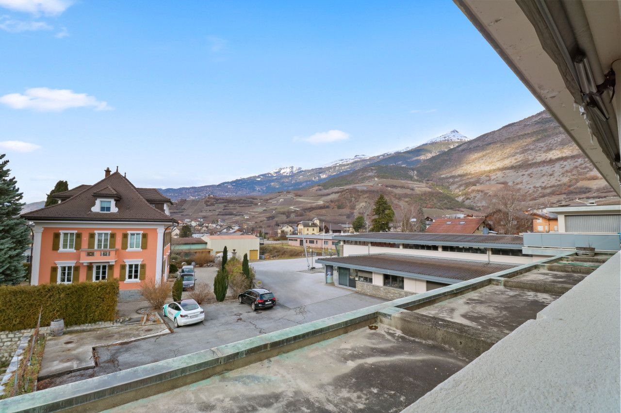 A residential area with a view of a mountain range.