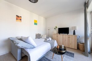 Fer et planche à repasser, draps fournis