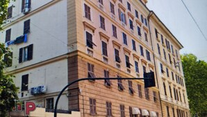 A multi-story building with a prominent 'P' sign indicating parking.