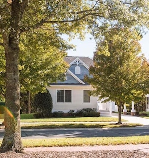 A single-story house with a gabled roof, a front porch, and a well-maintained lawn. - Bayside Resort:  Beautiful 5 Bedroom House with 3. (Selbyville)