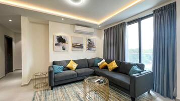 Standard Apartment | Living area | 43-inch LED TV with cable channels, pay movies