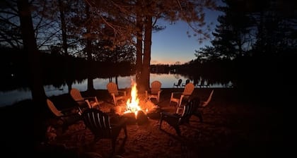 1/2 acre, 450 feet of lake frontage and a sandy beach with sunsets!