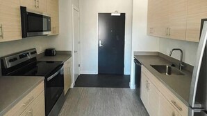 Coffee/tea maker, fridge, microwave, oven