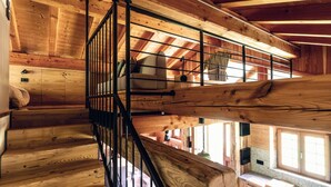 A wooden interior with a staircase leading to a loft bedroom. - Wonderful private villa for 6 guests with TV and pets allowed (Massimeno)