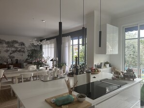 Enjoy cooking in this well-equipped kitchen with a central island and ample counter space.