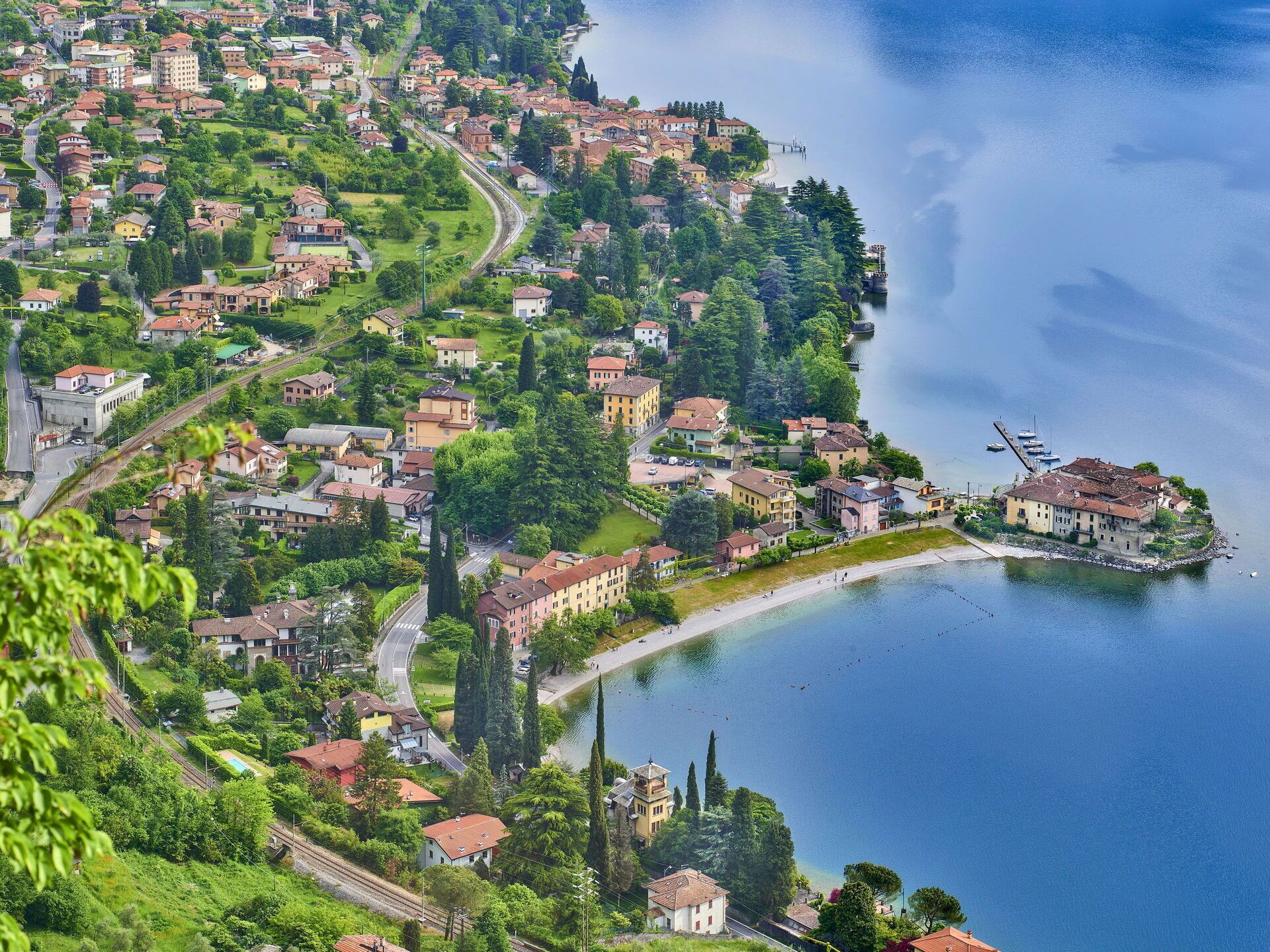 A coastal town with a mix of residential buildings and a prominent waterfront area.