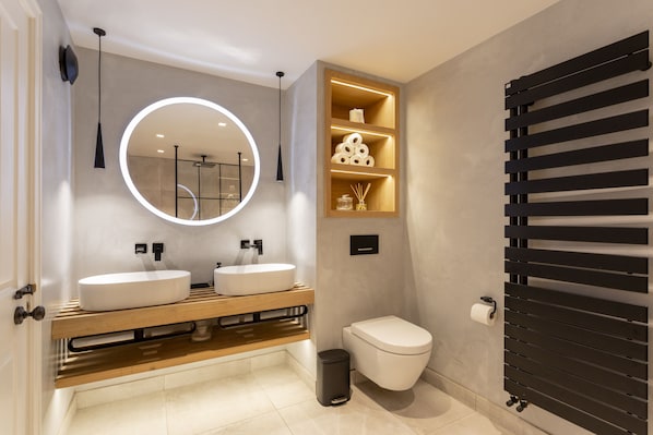 Shower, hair dryer, towels, toilet paper