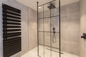 Shower, hair dryer, towels, toilet paper
