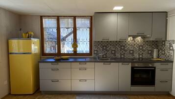 Oven, toaster, dining tables