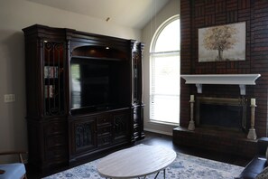 Smart TV, fireplace, DVD player, books