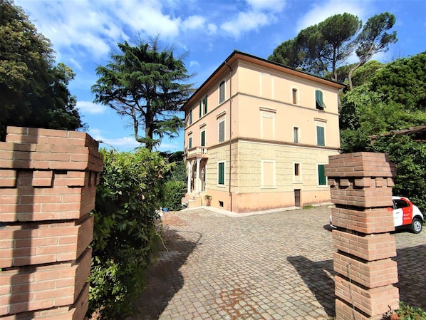 Stunning two-story building with a central entrance and paved driveway.