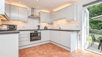 Microwave, oven, dishwasher, dining tables