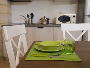 Microwave, dishwasher, toaster, dining tables