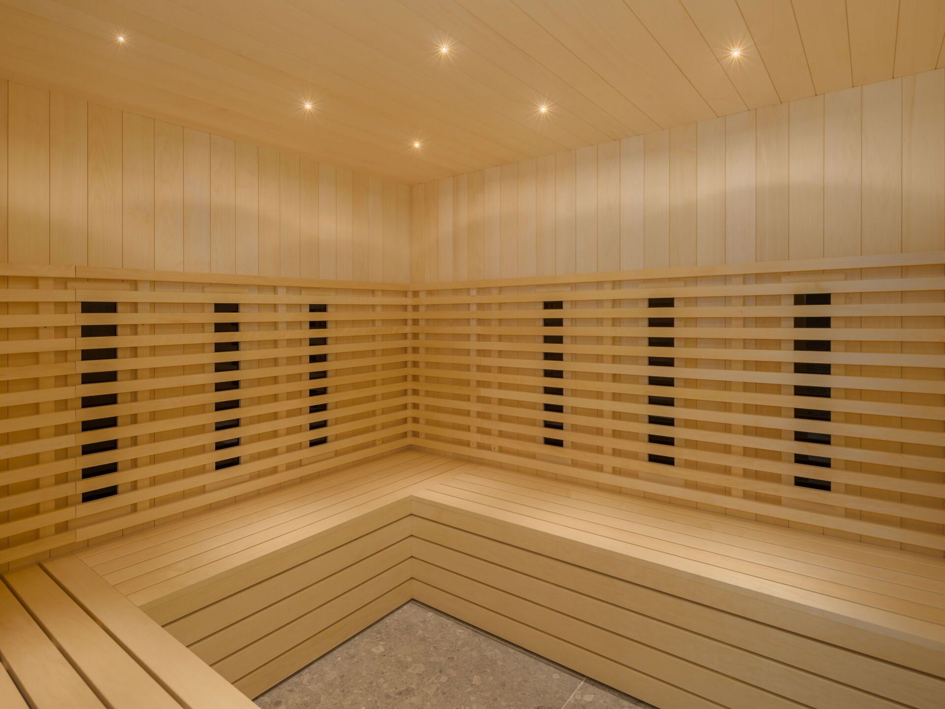 A sauna with wooden walls and benches.