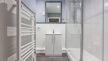 Shower, towels, soap, toilet paper