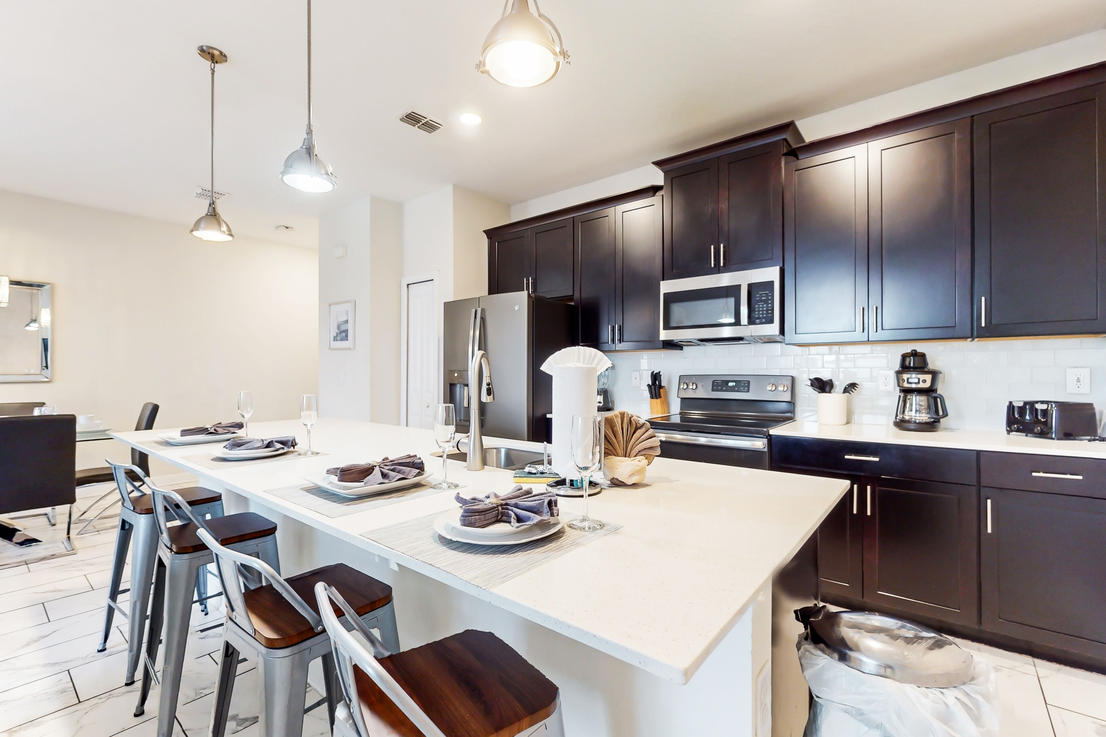 Updated townhome with pool, lazy river, game tables, gym, smart TVs, & W/D