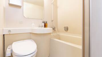 Combined shower/tub, free toiletries, hair dryer, slippers