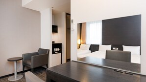 A hotel room with a bed, a desk, a chair, a small table, and a mirror. - The OneFive Osaka Namba Dotonbori (Osaka)