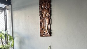 A room with two metal chairs, a small table, and a potted plant. - BAANFAHSAI ANU (Bangkok)