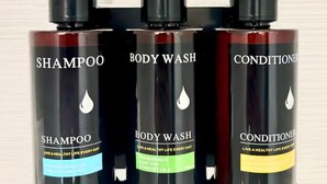 Three bottles of shampoo, body wash, and conditioner.