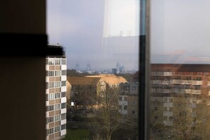 Guests enjoy a view of the surrounding cityscape from the comfort of their room.