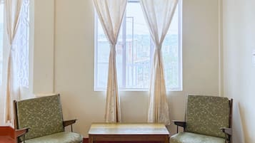 Suite Room | Living area | 32-inch LCD TV with cable channels