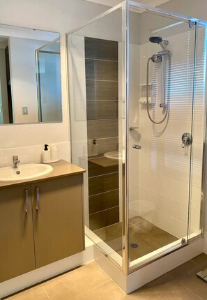 Shower, hair dryer, towels, soap