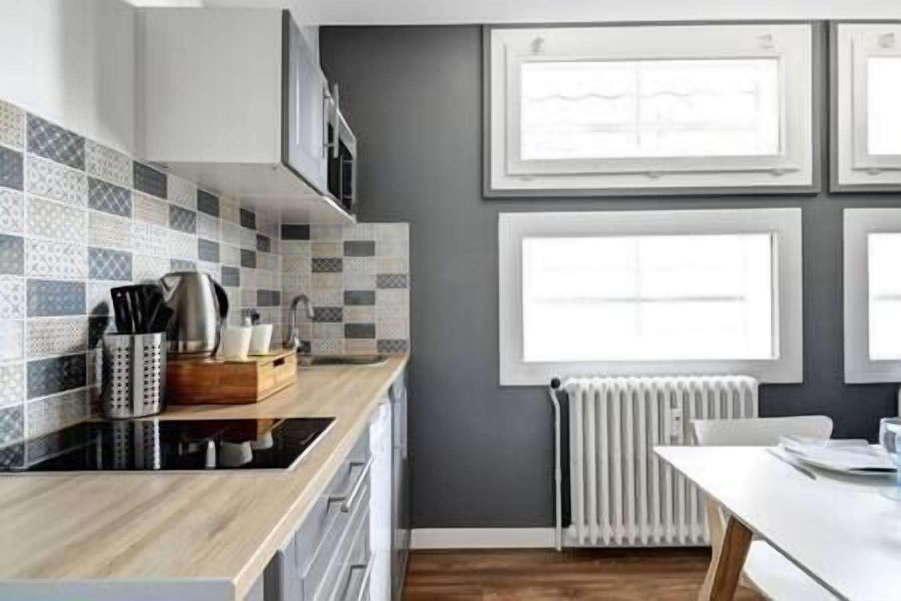 Fridge, microwave, coffee/tea maker, cookware/dishes/utensils