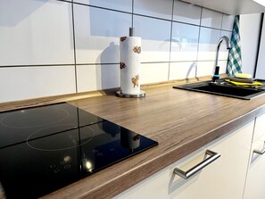 Fridge, microwave, stovetop, coffee/tea maker