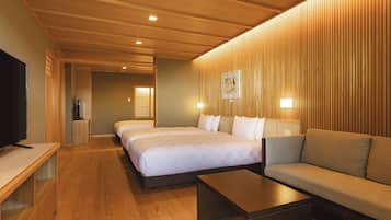 A hotel room with a wooden ceiling, two beds, a sofa, a TV, and a painting on the wall.