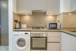 Apartamento conforto | Cozinha privada | Geladeira, micro-ondas, fogão, cooktop