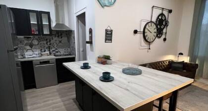 Chambre avec salon et cuisine commune