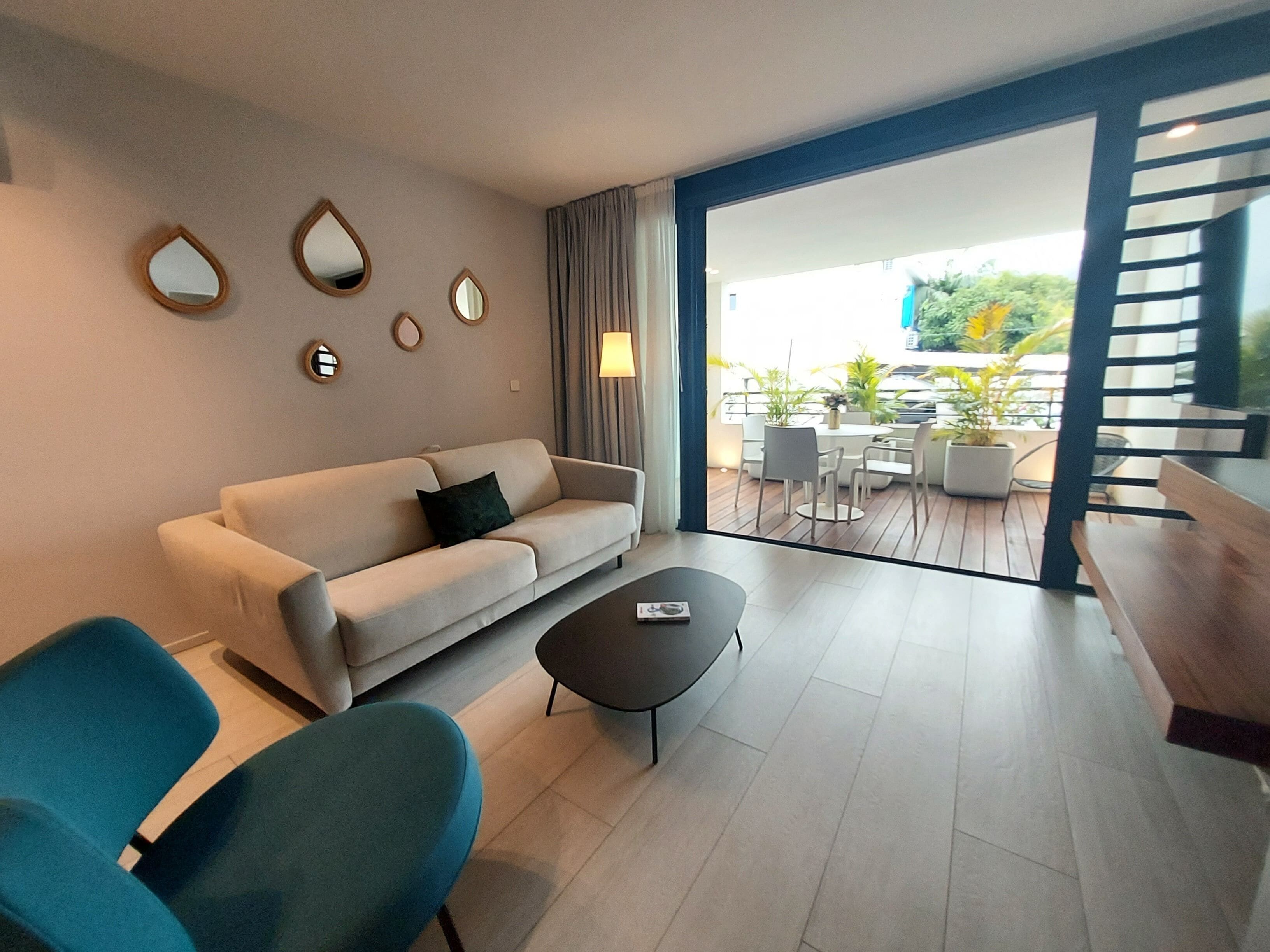 Apartment, City View | Living area | 140-cm LED TV with premium TV channels, streaming services