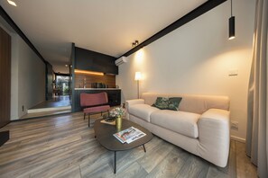 Apartment, Garden View, Ground Floor | Living area | 140-cm LED TV with premium channels, streaming services - Clos de la Rivière (Saint-Denis)