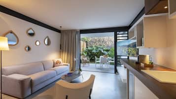 Apartment, Garden View, Ground Floor | Living area | 140-cm LED TV with premium channels, streaming services