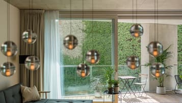 Apartment, Garden View (Garden Loft 80) | Living area | 85-inch Smart TV with digital channels, offices