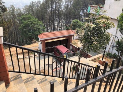 Home is located on the side of a mountain near a famous Buddhist monastery.  
