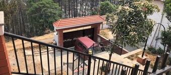 Home is located on the side of a mountain near a famous Buddhist monastery.