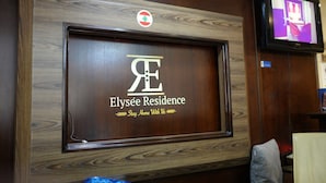 A wooden-framed display with the Elyse Residence logo and slogan. - Elyseeresidence Hotel  (Beirut)