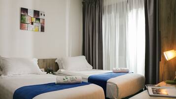 Premium bedding, pillow-top beds, in-room safe, individually decorated