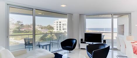 Apartment | Living area | 45-inch flat-screen TV with satellite channels