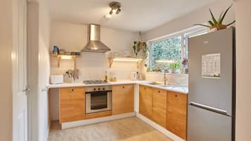 Fridge, coffee/tea maker, cookware/dishes/utensils