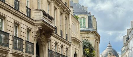 A historic building with ornate architectural details, including columns and decorative moldings.