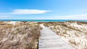 A wooden boardwalk leading to a beach with clear skies and distant ocean views. - Oyster House B2 - Sleeps 20 - Beachfront w/ Pool (Gulf Shores)