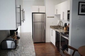 Fridge, microwave, oven, stovetop - Walk to Everything From The Lofts Suite 309 (West Palm Beach)