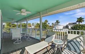 Outdoor dining - Redfish Retreat - South End Pool Home (Fort Myers Beach)
