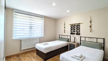 3 dormitorios, tabla de planchar con plancha, wifi y ropa de cama