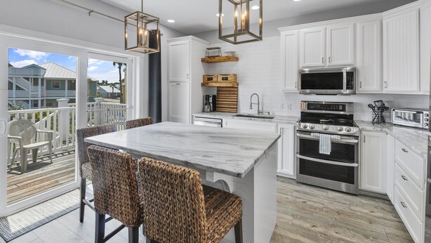 House, Multiple Beds, Patio, Pool View (Casa Azul) | Private kitchen | Coffee/tea maker, dining table - Casa Azul - Boardwalk to the Beach! (Port Aransas)