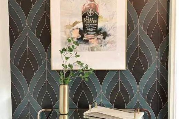 Elegant bar cart with bourbon-themed art and glassware